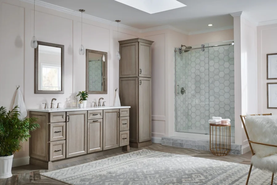 Elegant bathroom vanity with a double sink, quartz countertop, brushed‑gold faucets, and a large framed mirror with crystal-accented lighting above.